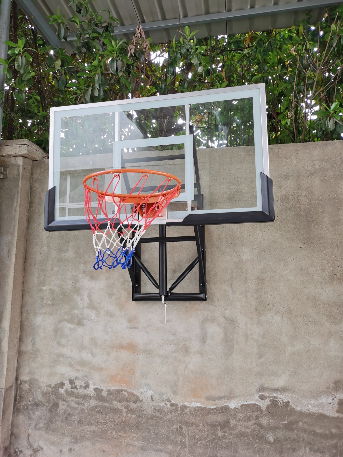 Wall-Mounted Basketball Hoop On Wall Photo
